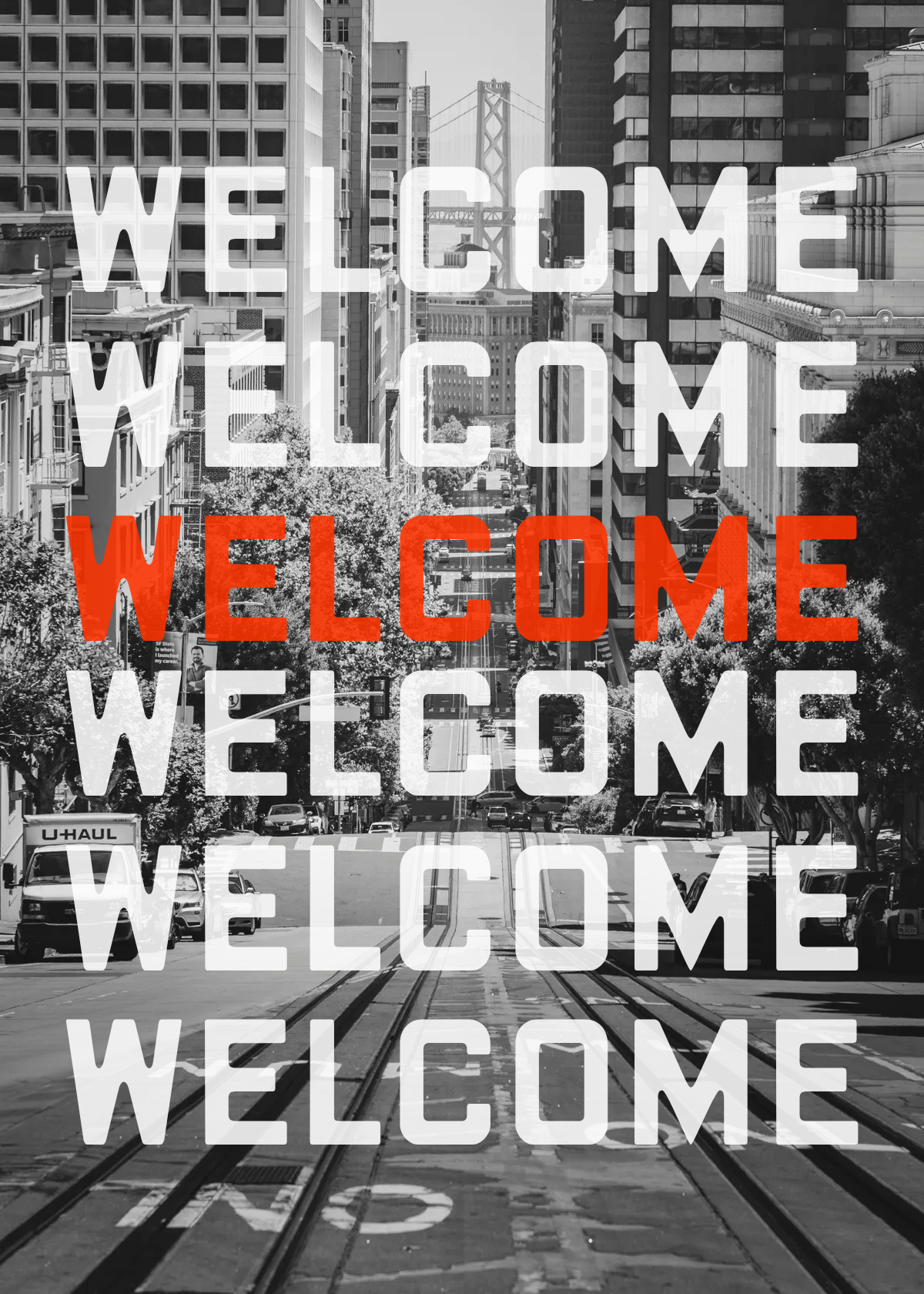 The word WELCOME repeated down a black-and-white San Francisco street, one line set in orange.